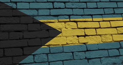 A panning video of a brick wall with the bahamas flag Stock Footage 337427157