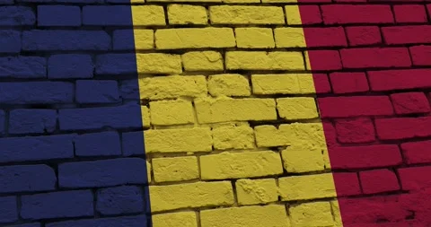 A panning video of a brick wall with the chad flag Stock Footage 337427849