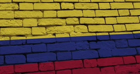 A panning video of a brick wall with the colombia flag Stock Footage 337428046
