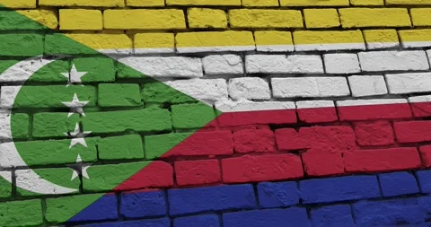 A panning video of a brick wall with the comoros flag Stock Footage 337428075