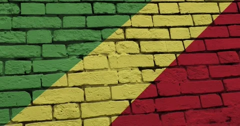 A panning video of a brick wall with the congo republic flag Stock Footage 337428103