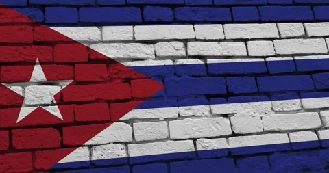 A panning video of a brick wall with the cuba flag Stock Footage 337428136