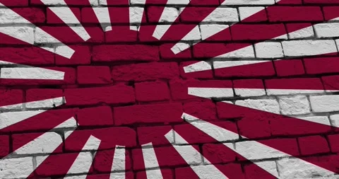 A panning video of a brick wall with the empire of japan flag Video stock 337429304