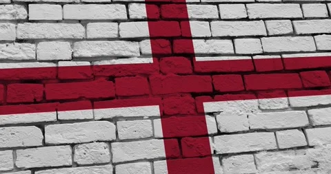 A panning video of a brick wall with the england flag Vídeos de archivo 337428313