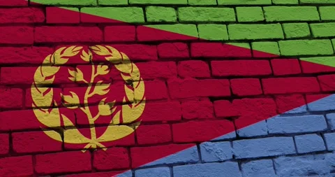 A panning video of a brick wall with the eritrea flag Stockbeeldmateriaal 337428311
