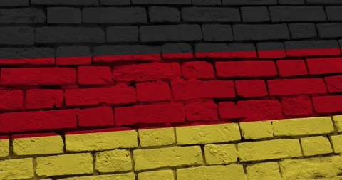 A panning video of a brick wall with the germany flag Video stock 337428744