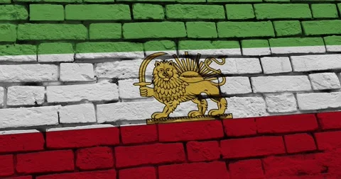 A panning video of a brick wall with the imperial iran flag Vídeos de archivo 337429068