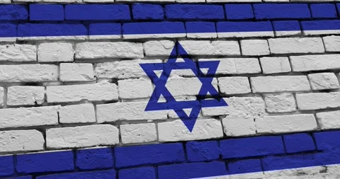 A panning video of a brick wall with the imperial israel flag Video stock 337429245