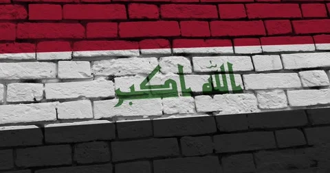 A panning video of a brick wall with the iraq flag Video stock 337429073
