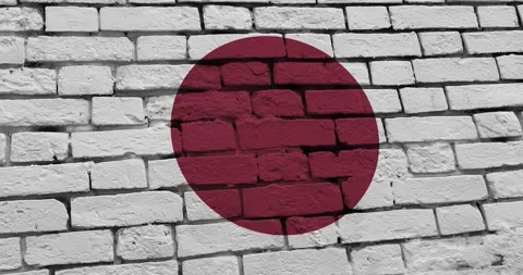A panning video of a brick wall with the japan flag Video stock 337429295