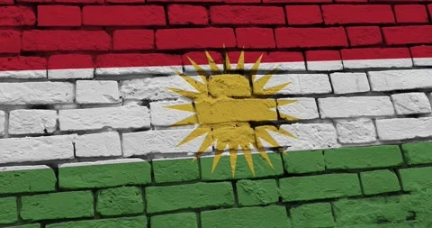 A panning video of a brick wall with the kurdistan flag Video stock 337429361