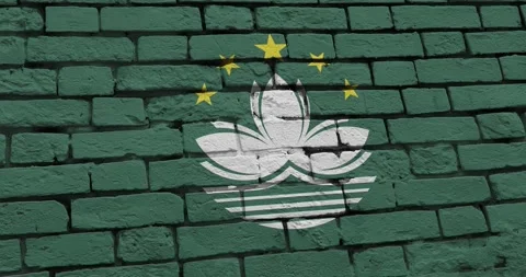 A panning video of a brick wall with the macau flag Video stock 337429687