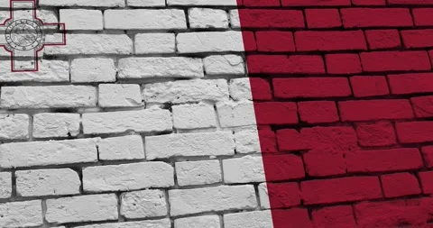 A panning video of a brick wall with the malta flag Stockbeeldmateriaal 337429746