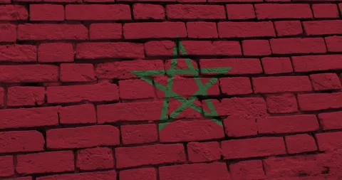 A panning video of a brick wall with the morocco flag Video stock 337429825