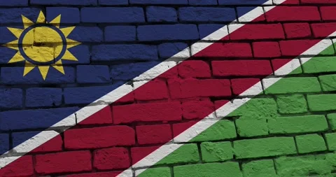 A panning video of a brick wall with the namibia flag Video stock 337429868