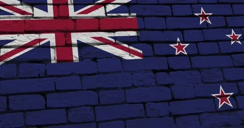 A panning video of a brick wall with the new zealand flag Vídeo Stock 337431112
