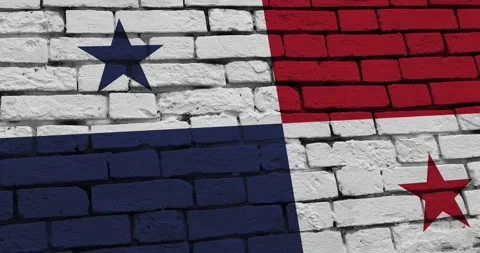 A panning video of a brick wall with the panama flag 스톡 동영상 337431154