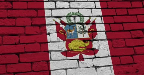A panning video of a brick wall with the peru flag Video stock 337431181