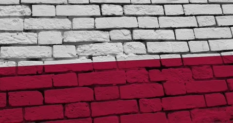 A panning video of a brick wall with the poland flag Video stock 337431221