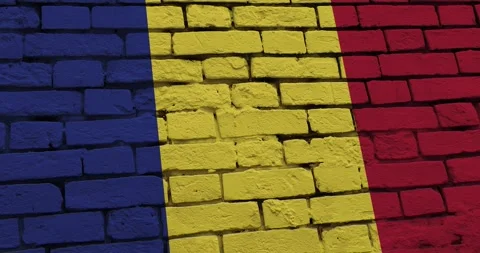 A panning video of a brick wall with the romania flag Video stock 337431270
