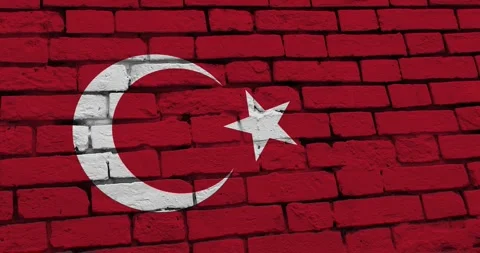 A panning video of a brick wall with the turkey flag Video stock 337432613