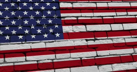 A panning video of a brick wall with the united states of america flag Vídeo Stock 337432675