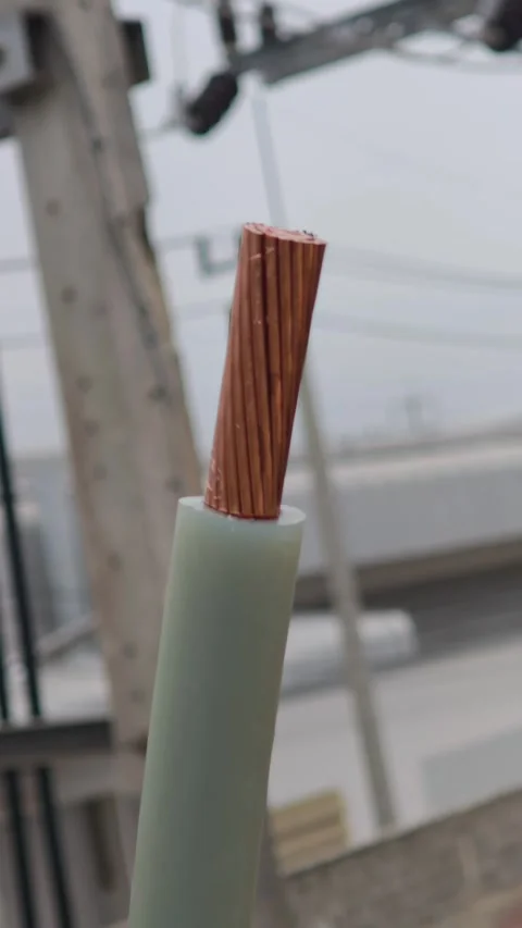 Panning up video of a thick stripped copper underground cable. Stock Footage 339049384