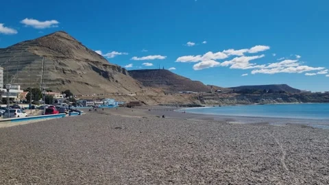 Panning view across the deserted Atlantic beach of Comodoro Rivadavia, Argentina Stock Footage 342743544