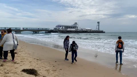 A panning view along the beach at Bournemouth in Dorset, UK on an autumn day. Stock Footage 220802995