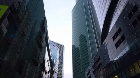 Panning view from below of the office tower buildings with vertical rotation Stock-Footage 104826089