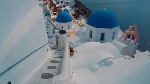 Panning View Of Blue Dome Churches And Caldera In Santorini Island, Greece Stock Footage 100063308