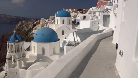 Panning view of blue dome churches and Caldera in Santorini Island, Greece Video stock 124726973
