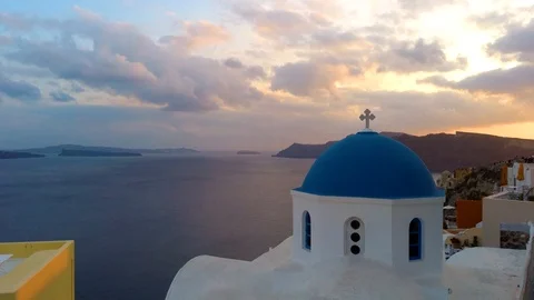 Panning view of blue dome churches and Caldera in Santorini Island Video stock 125954553