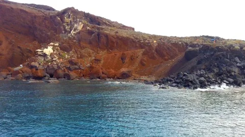 Panning view of blue dome churches and Caldera in Santorini Island Stock Footage 125979436