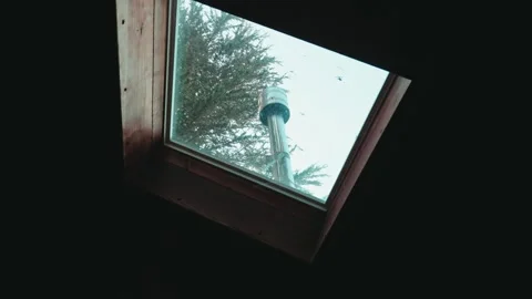 Panning View of a Chimney and Sky Through a Skylight Stock Footage 317530382
