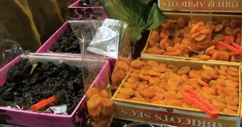 Panning view of a display of different variety of organic dried fruits Stock Footage 69241803