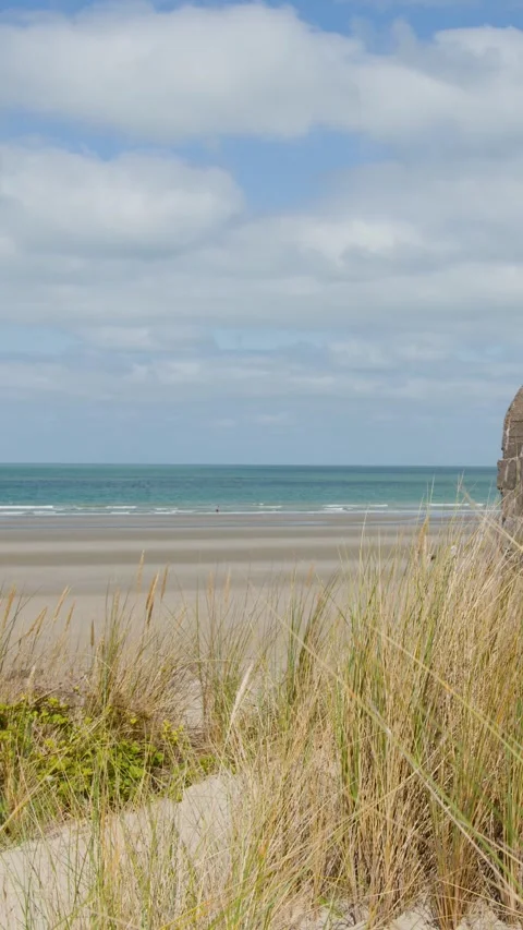Panning View of Dunkirk Beach Bunker and Tranquil Coastline Stock Footage 324685402