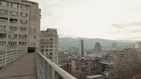 Panning view left to Tbilisi city panorama from top building in Saburtalo dis Stock Footage 147345834