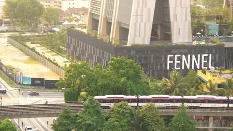 Panning view of Light Rapid Transit (LRT) train at sub-urban Kuala Lumpur Video stock 106601100