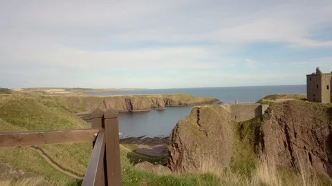 Panning view looking at the Dunnotar Castle in Scotland Stock Footage 99935885
