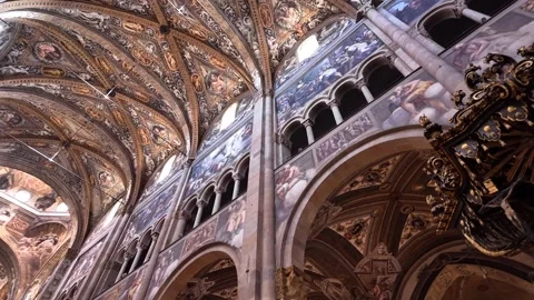 Panning view looking up at painted high ceilings inside cathedral, Parma, Italy Stock Footage 296630003
