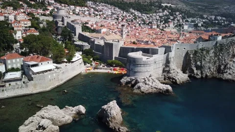 Panning view of the mighty city wall at old town Dubrovnik and Pile Bay on Stock Footage 142139671