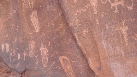 Panning view of Native American rock art on large rock Stock Footage 76894595