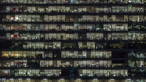 Panning up view of office windows with working people Stock Footage 123007868
