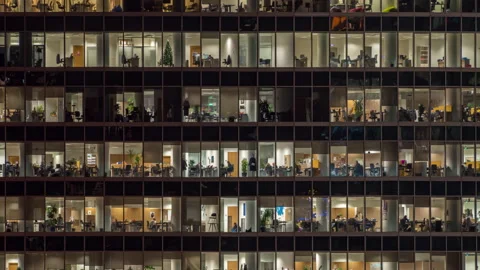 Panning up view of office windows with working people Stock Footage 169072302