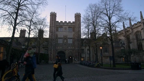 Panning view of St John's college gate and central Cambridge at sunset Stock Footage 102433536