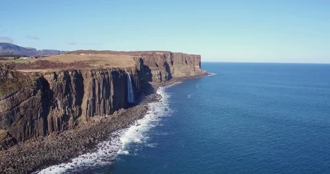 Panning view waterfall and dramatic coastline at Kilt Rock, Skye drone aerial 4K Stock Footage 104582887