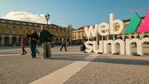 Panning of Web Summit sign at Praca do Comercio, Lisbon, Portugal on a sunny day Stock Footage 312504454