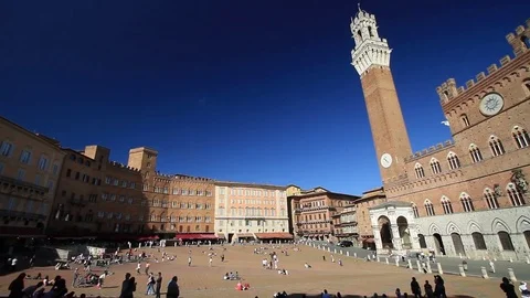Pano of Campo Square, Mangia Tower and Town Hall  (Palazzo Pubblico) of Siena Stock Footage 76199211
