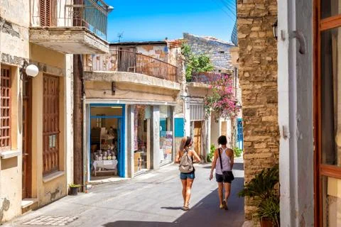 PANO LEFKARA, CYPRUS - JUNE 17, 2018: Girls walks through a village Stock Photos